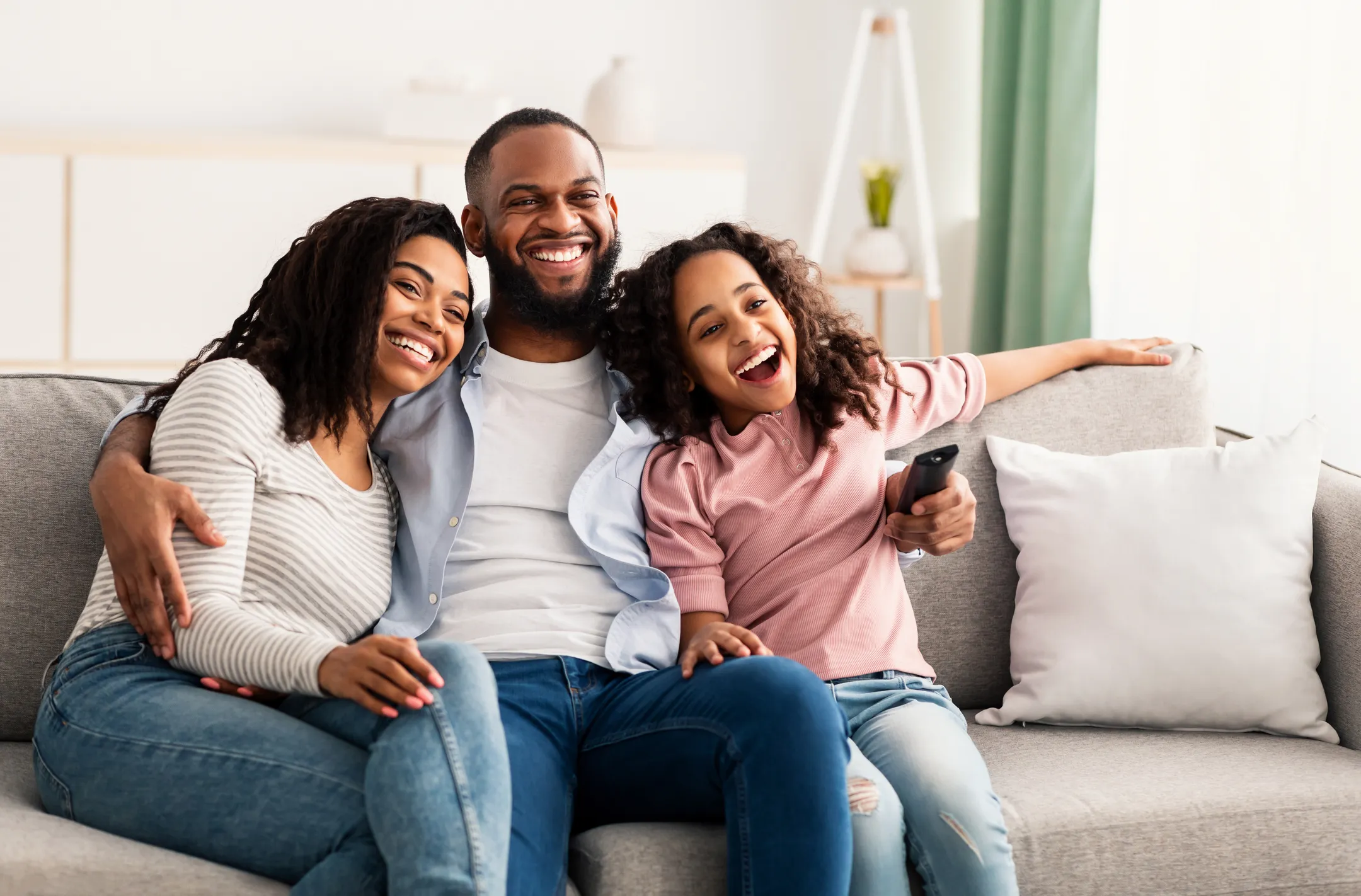 A family sitting together watching tv in Leesburg