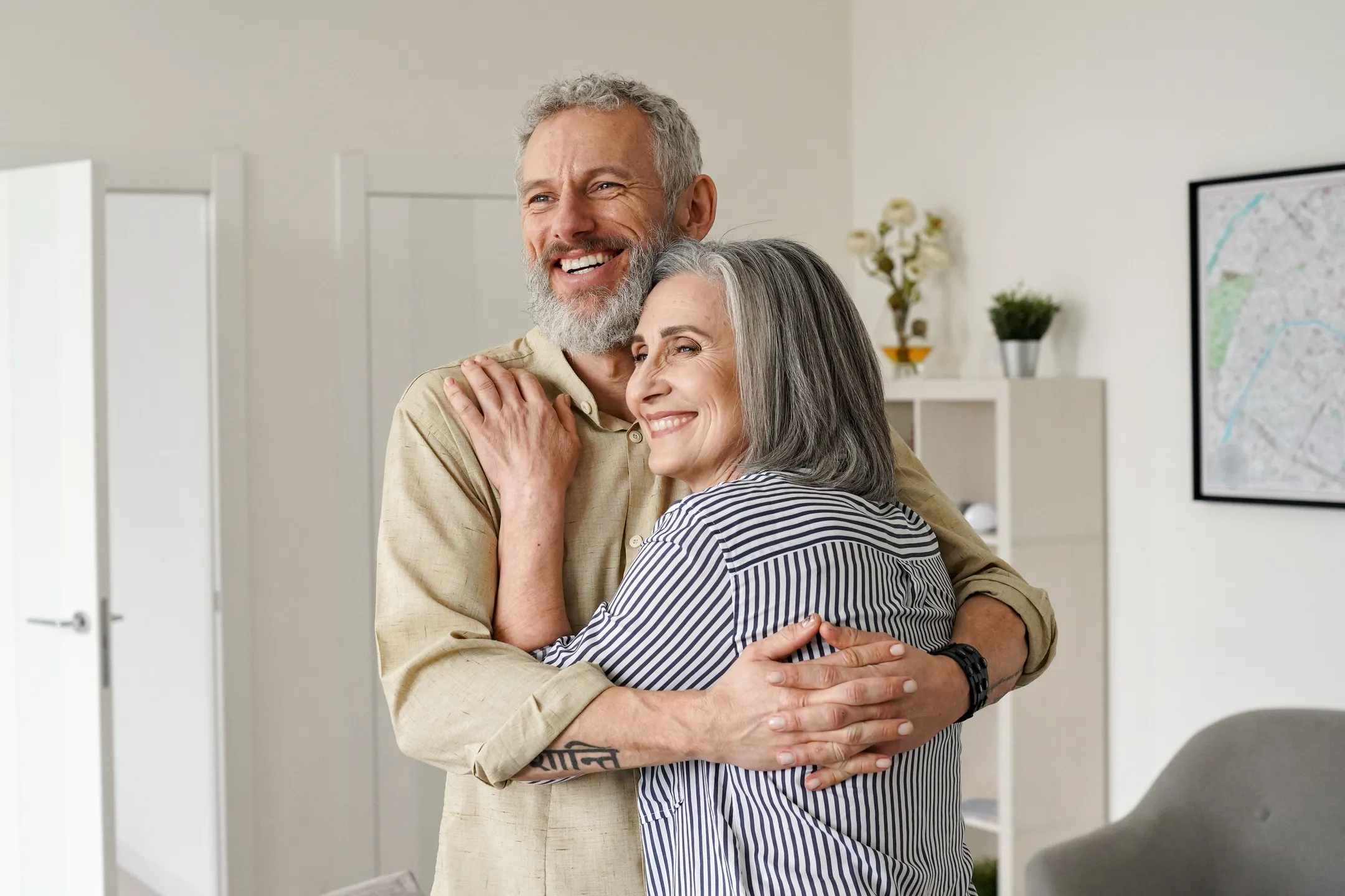 Satisfied homeowners hugging each other in their home in Sorrento Florida