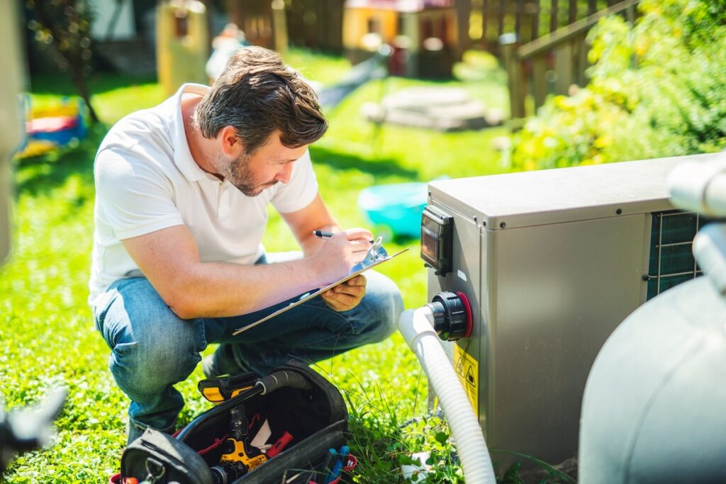 technician working on heat pump
