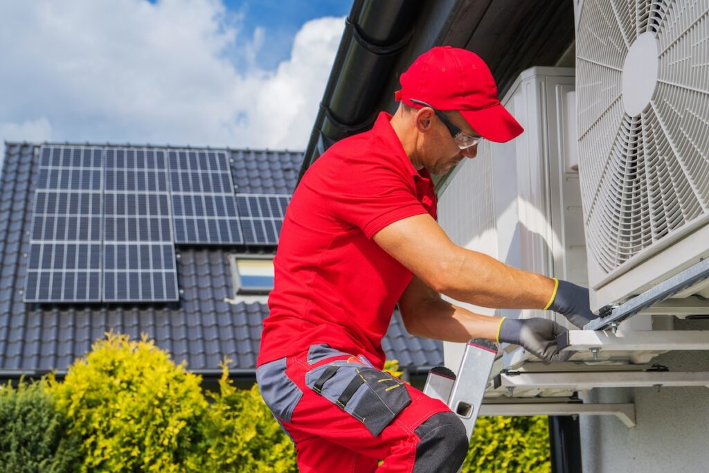 HVAC Worker Performing Heat Pump Maintenance in leesburg fl