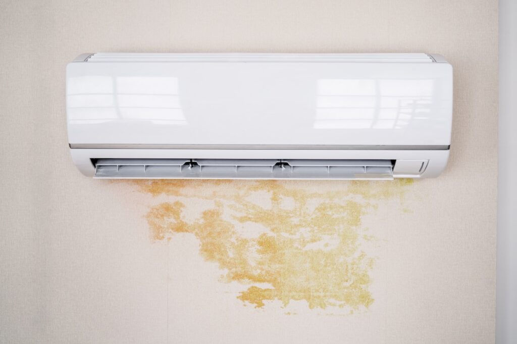 Leaky Air Conditioner And Water Damage On Wall At Home