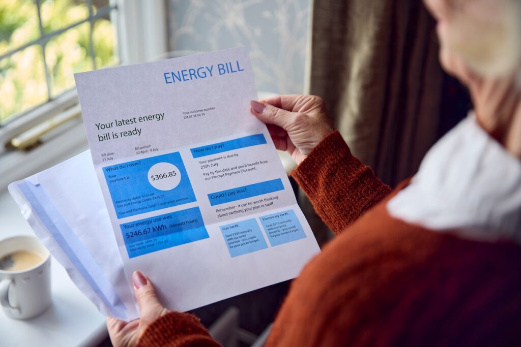 ac freon recharge Close Up Of Senior Woman Opening UK Energy Bill Concerned About Cost Of Living Energy Crisis