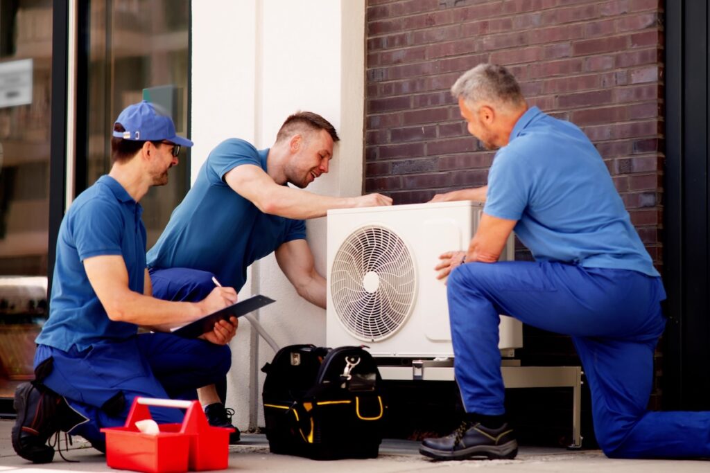 Skilled HVAC technician ensures efficient air conditioning in commercial buildings by installing units, conducting maintenance and safety inspections.