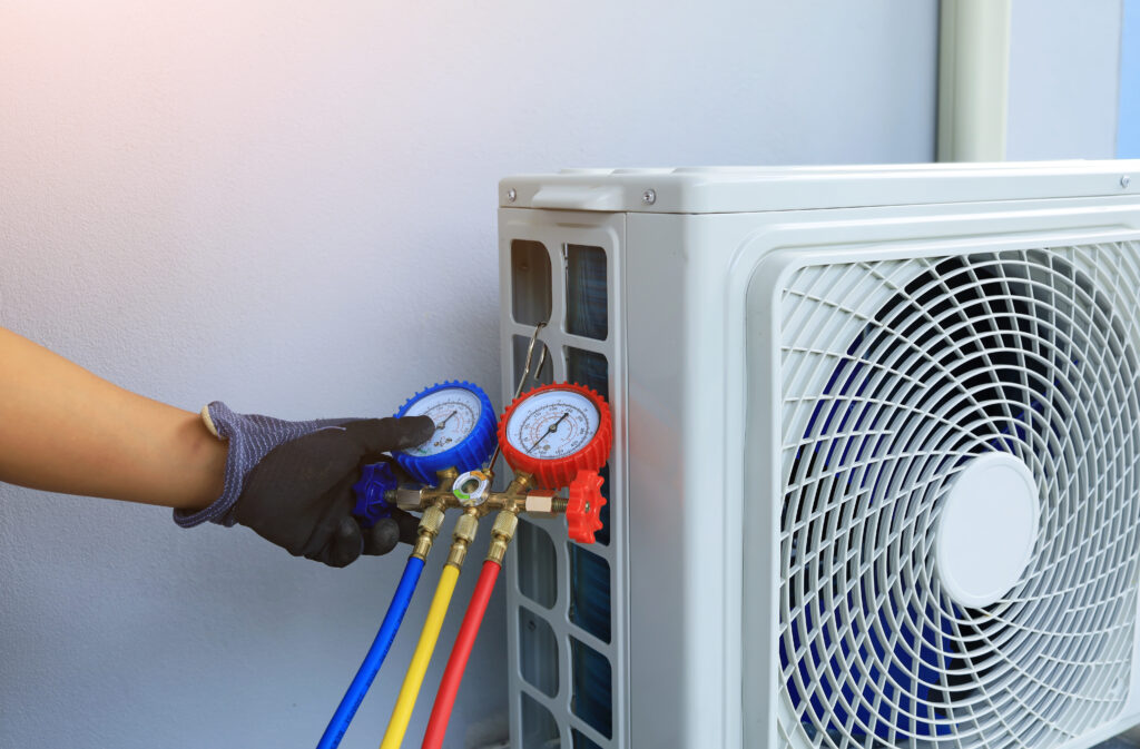 An air conditioner technician fixing temperature