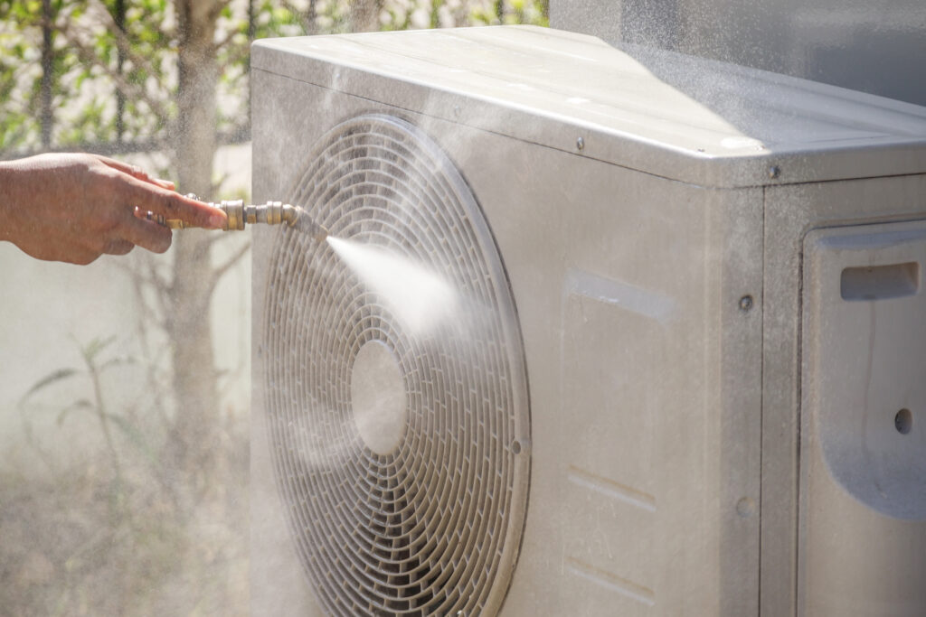 air conditioning compressor outdoor unit cleaning service with water spray