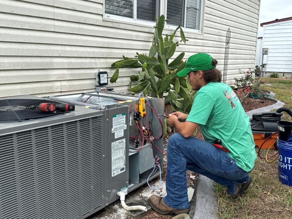 Bob's AC worker fixing AC whole house air purification systems.