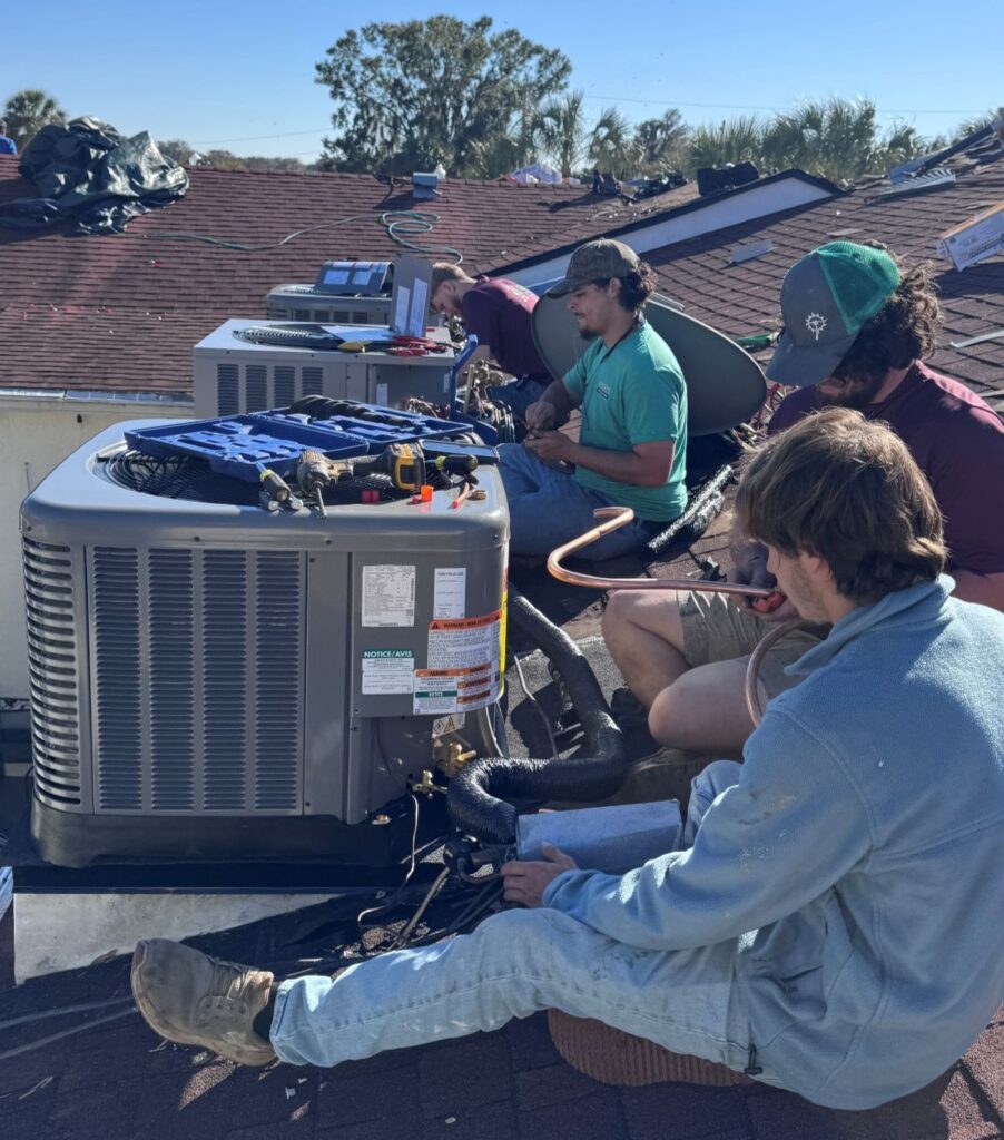 Bob's AC workers fixing Air conditioner