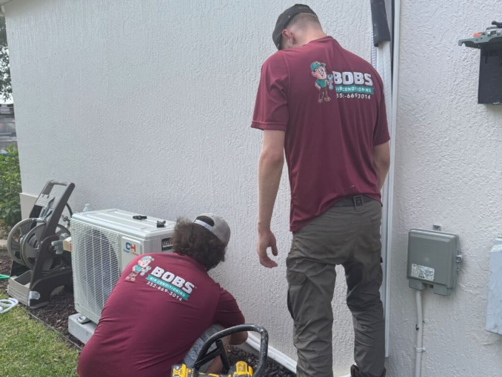 dirty air filter symptoms Bob's AC workers installing HVAC