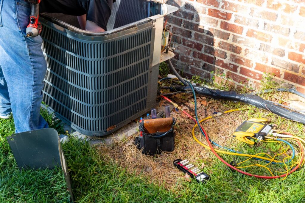 ac breaker keeps tripping worker repairing unit