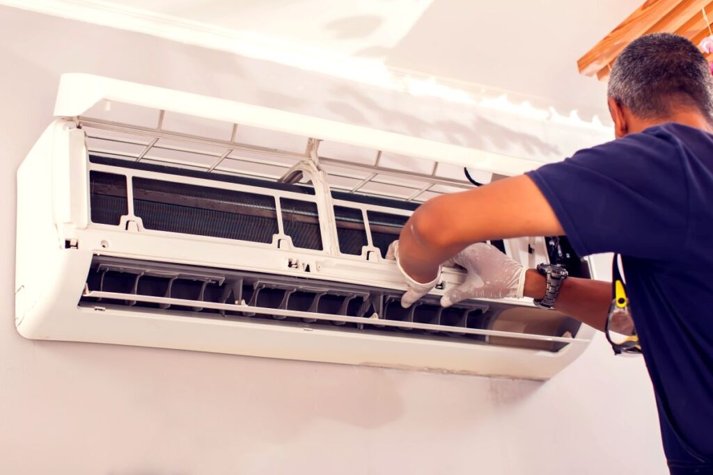 ac installation the villages fl worker installing white unit