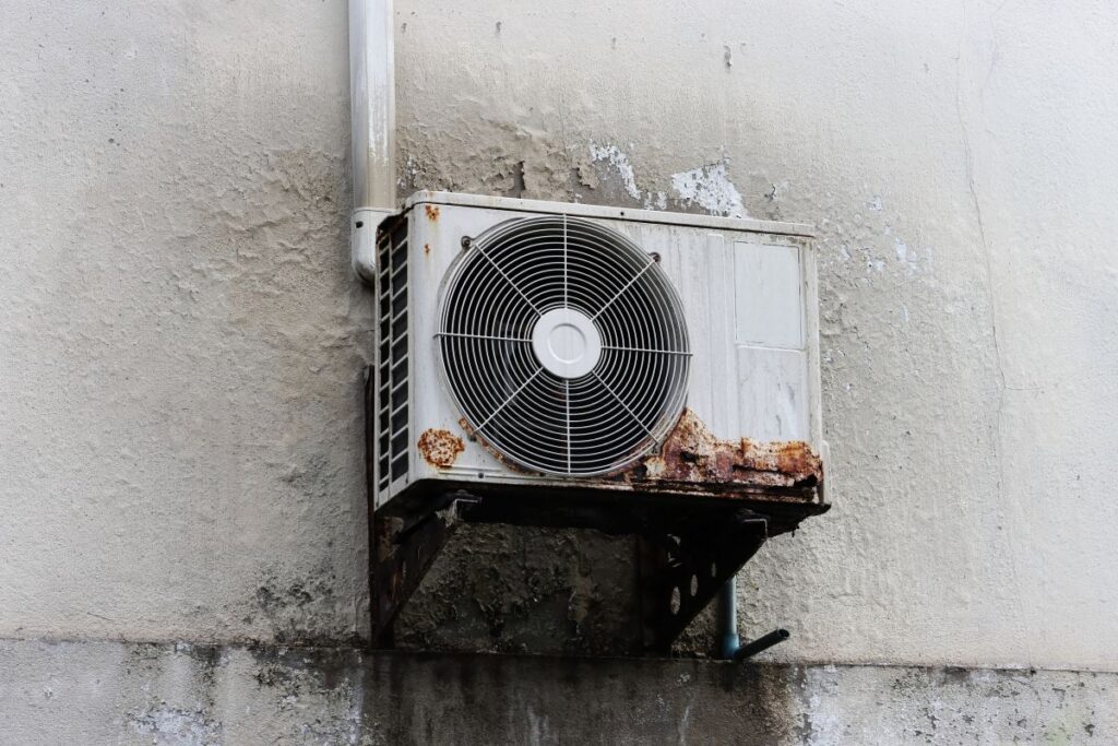 ac running but not cooling house rusty old air conditioner on wall