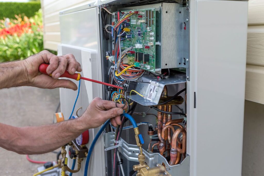 heat pump installation lady lake fl worker repairing unit